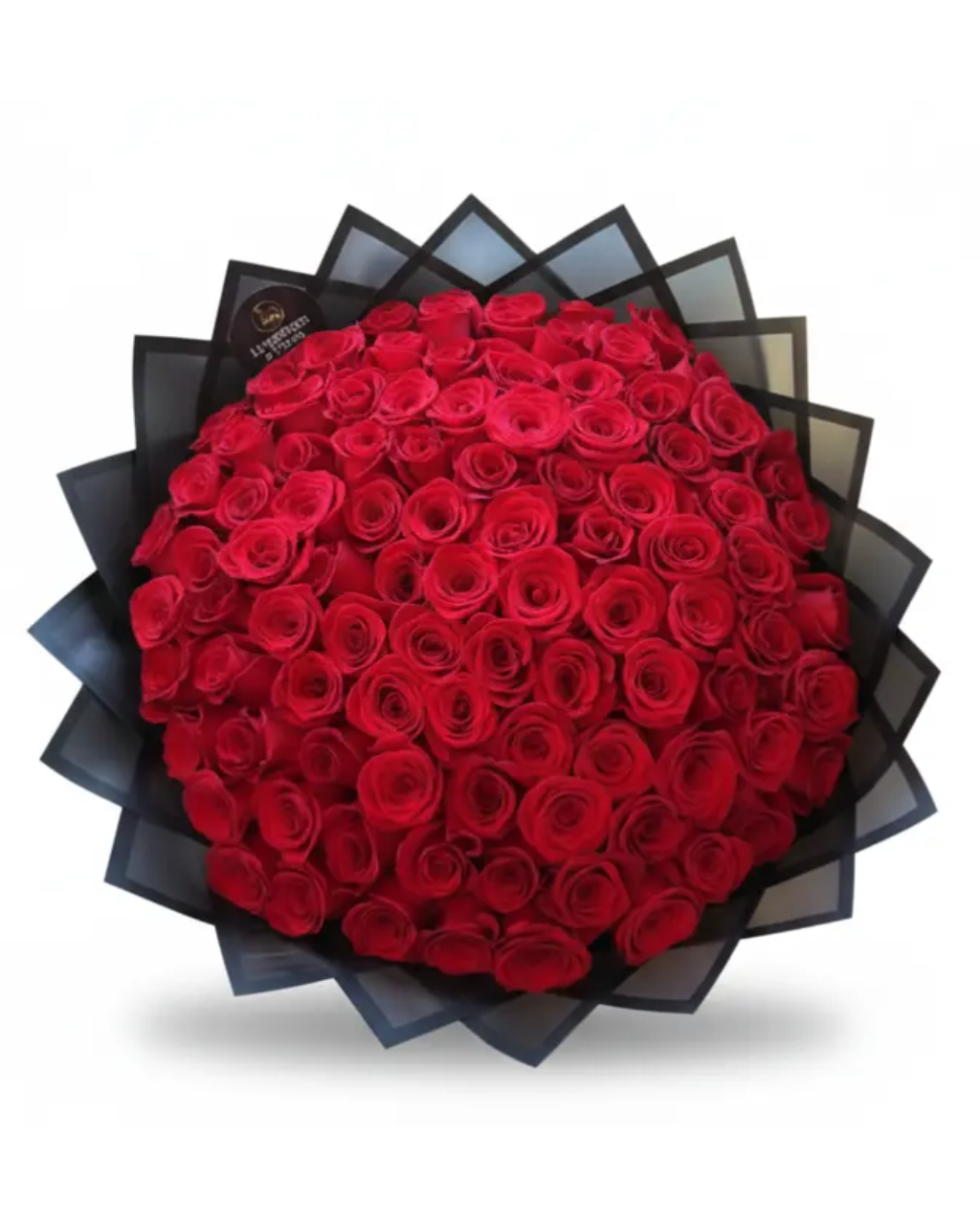 Round arrangement of red roses in a black box on a white background