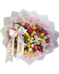 Bouquet of multicolored tulips with decorative ribbons on a white background