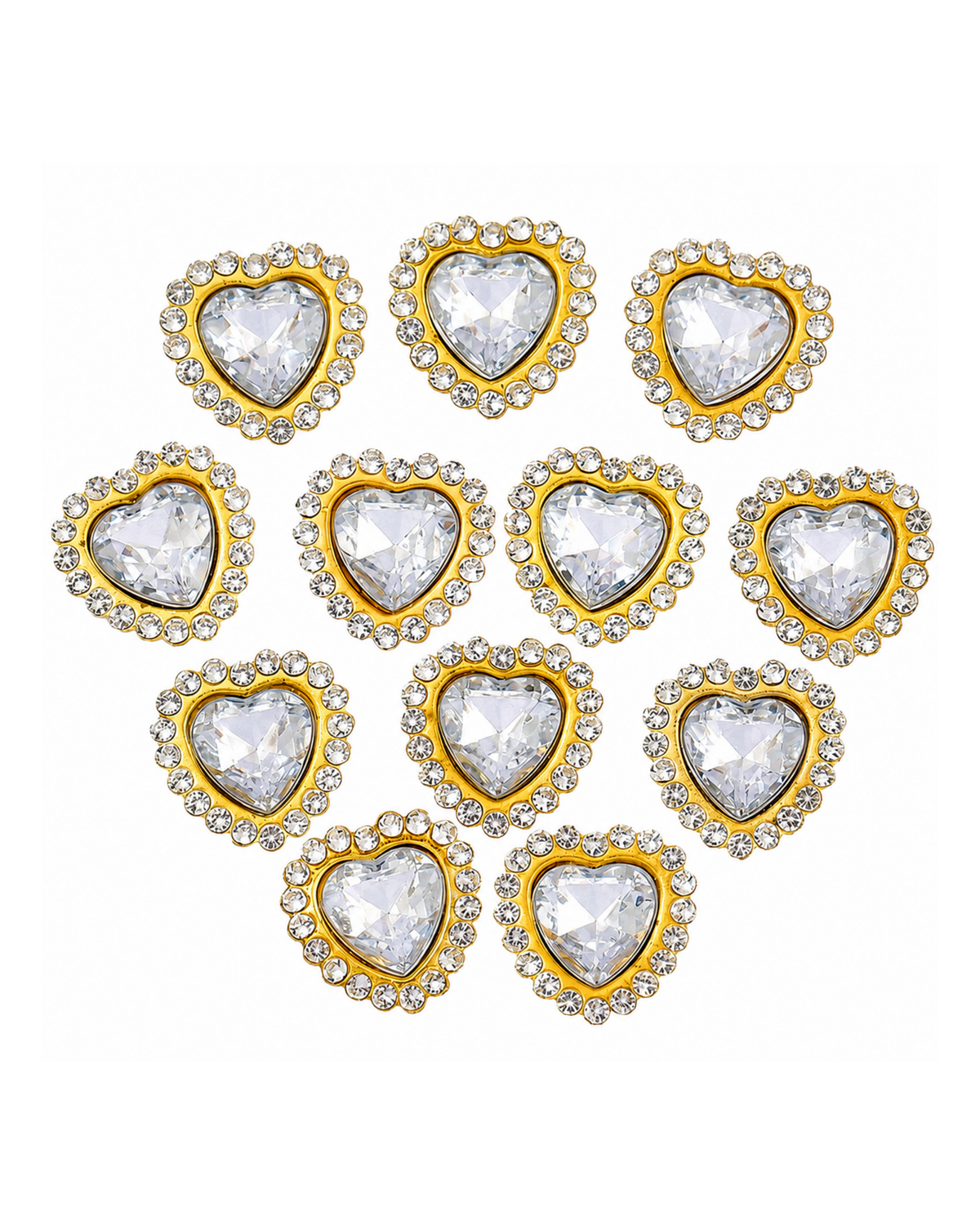 Nine heart-shaped clear rhinestone studs with gold borders, arranged in a loose triangular pattern on a plain white background.