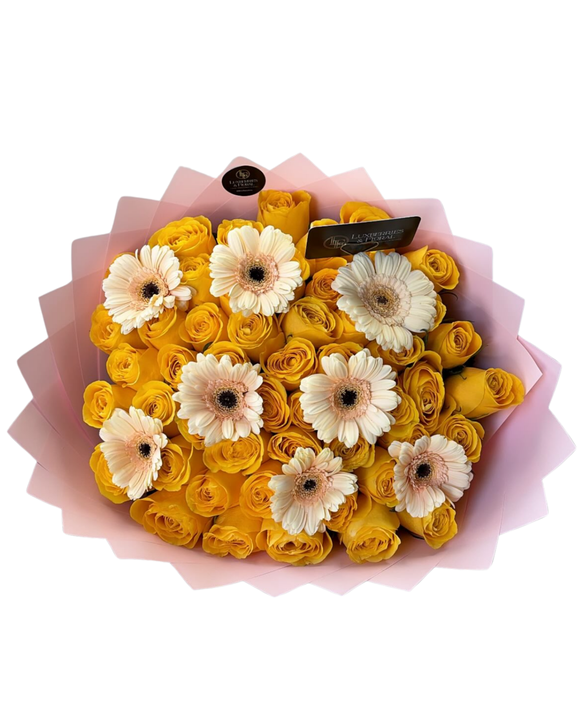 A bouquet of yellow roses mixed with white and cream Gerbera daisy flowers, wrapped in a pink paper wrapper on a white background.