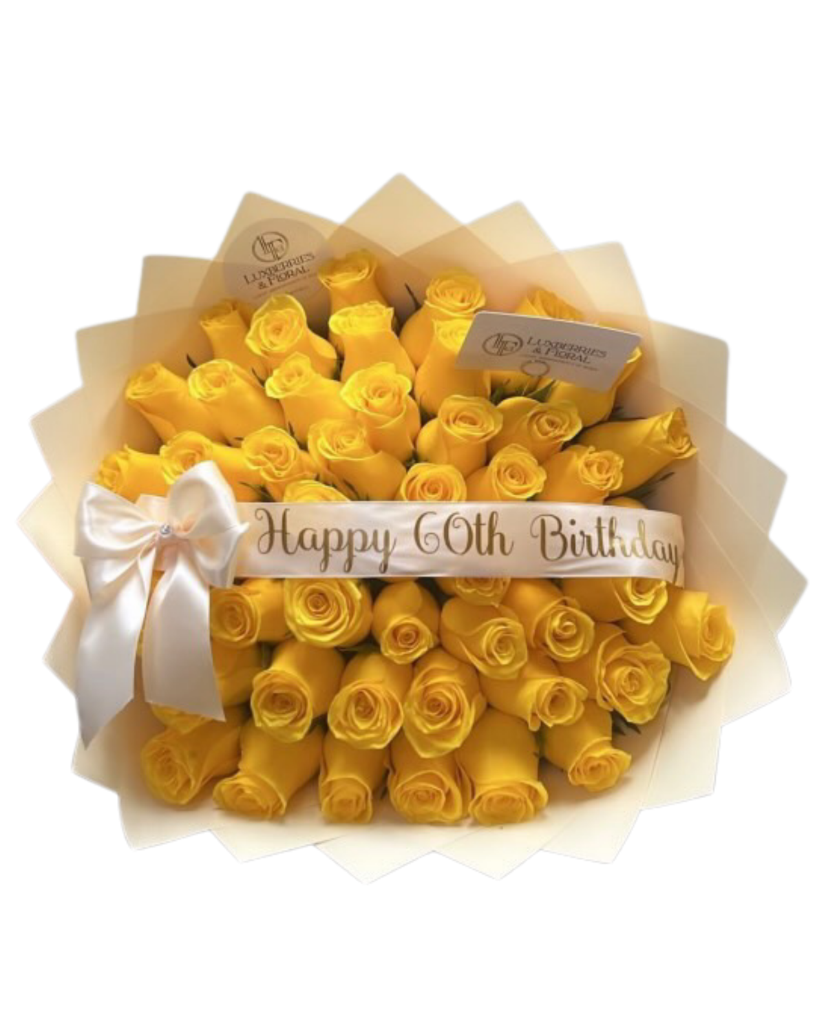 A bouquet of yellow roses wrapped in cream paper, tied with a white ribbon that reads 'Happy 60th Birthday', on a white background.