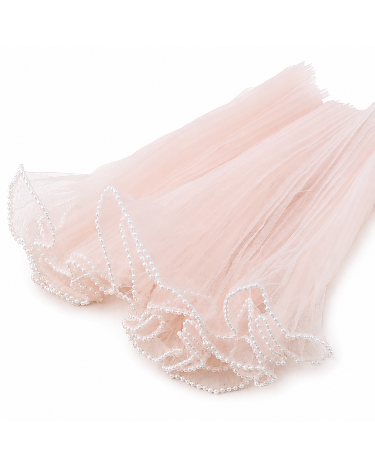A light pink tulle tutu skirt with delicate white pearl bead trim along the ruffled edge, displayed on a clean white background.