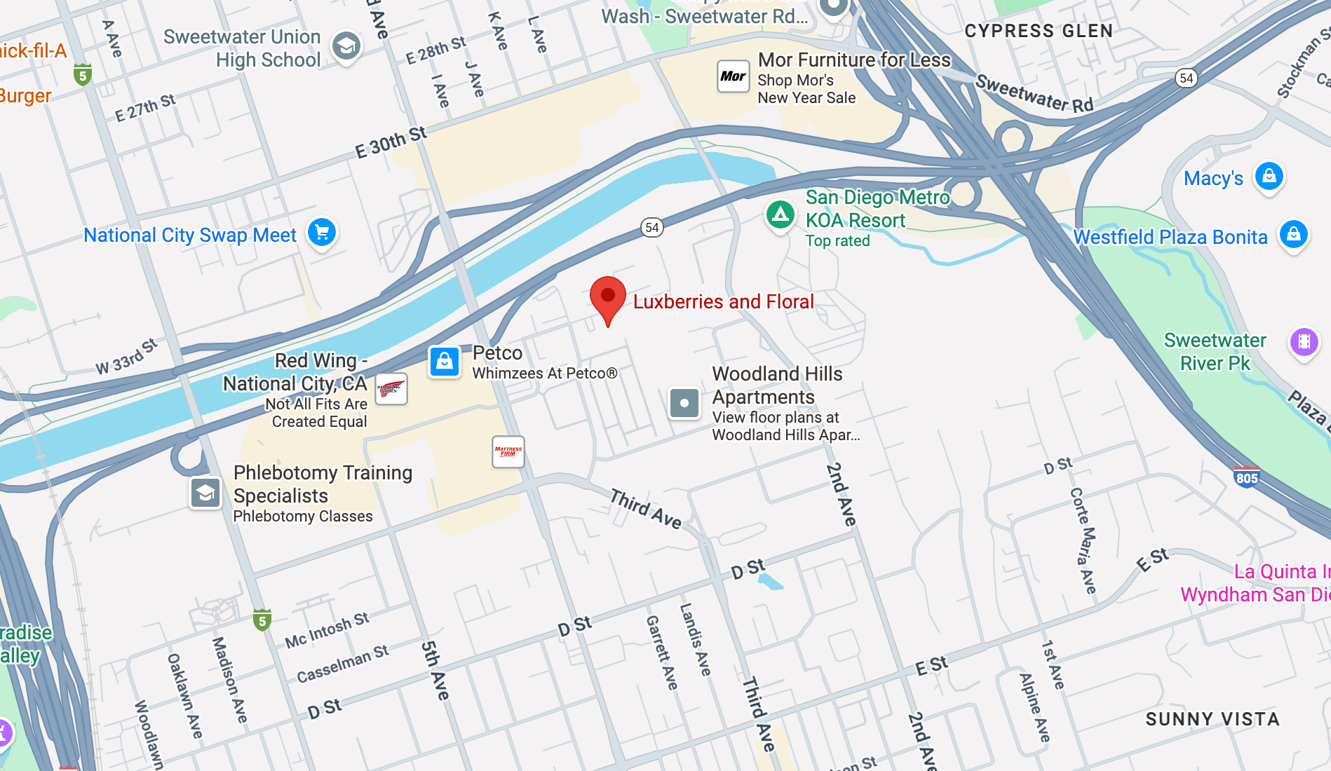 Map of a city street with various locations marked, including a red pin indicating a specific area.