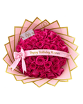 A heart-shaped bouquet of vibrant magenta pink roses. 'Happy Birthday Mi amor'.